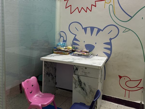 A child-sized activity corner with painted animal murals at CureAble Dwarka.