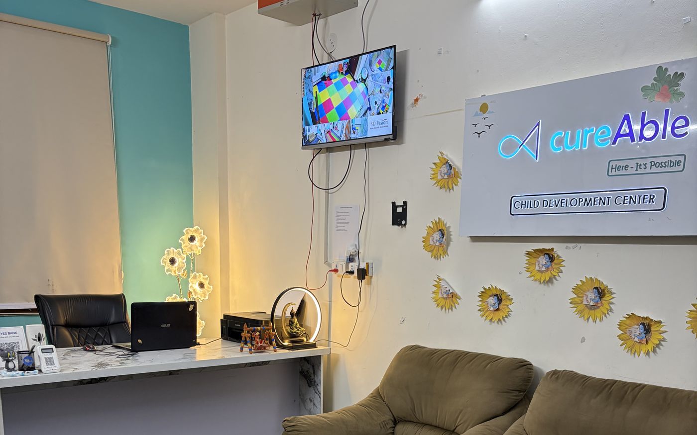 The reception area at CureAble Dwarka, with the CureAble Child Development Center sign.